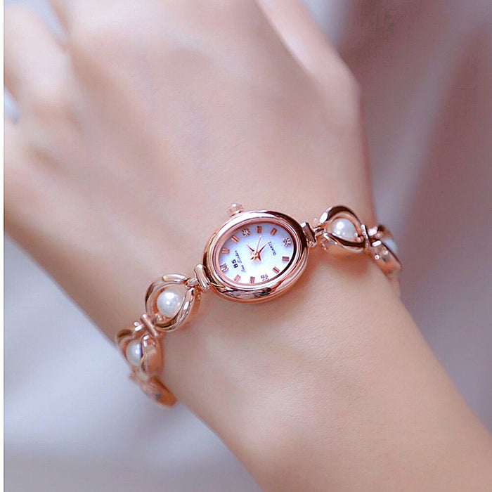 Oval dial pearl link watch soft pink white pearl