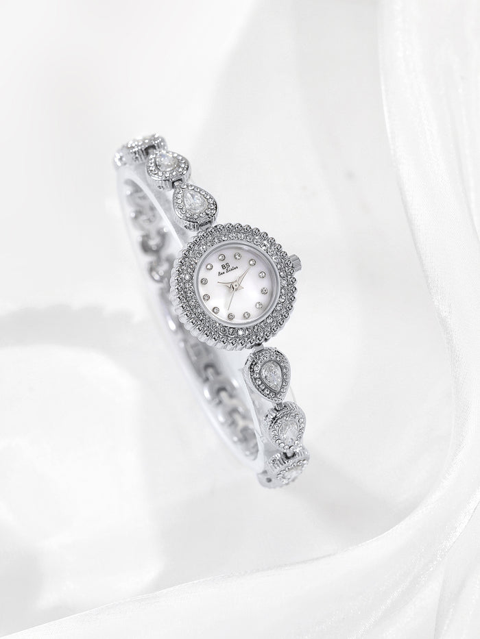 Mother of pearl teardrop watch silver link white gems