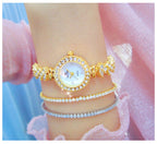 Round Crystal Bezel Floral Link Watch